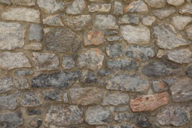 Duvarın dokusunun ve tahılının açıkça görülebildiği granit taşlardan yapılmış taş işçiliği arka plan ve mimari dokular için uygundur..