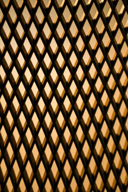 Yumuşak ışıklandırmalı geometrik bir şablona yakın çekim. Arkaplan, doku veya soyut tasarım kavramları için ideal.