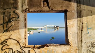 The photo shows a window with a view of the water collection station in the city of Corumb, state of Mato Grosso do Sul, Brazil, to the Paraguay River, on the border with Bolivia. The city is considered the capital. clipart