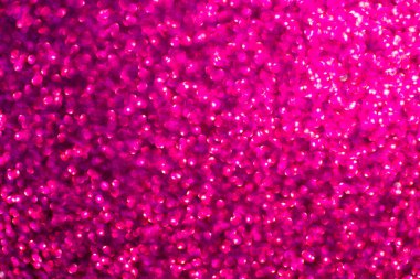 Soyut, ışıldayan ahududu arkaplanı ve bokeh etkisi. Doku zengin bir parıltı ve lüks hissi yaratıyor, tasarım, reklam, ambalaj, tebrik kartları, dekoratif projeler için mükemmel..