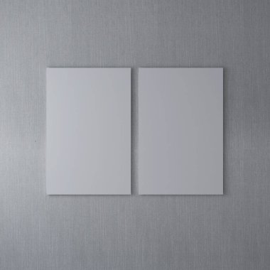 Gri bir duvarda iki boş dikey çerçevenin maketi. 3D görüntüleme, iç tasarım, 3B illüstrasyon