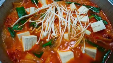 Kimchi soup in the pot is being boiled. High quality 4k footage