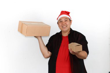 Happy Man wearing Santa Hat Delivering Christmas Gifts clipart