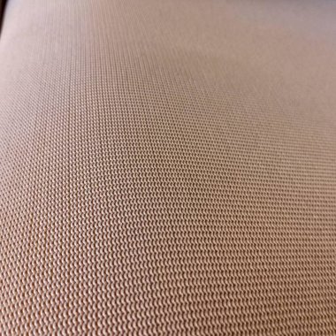 Close-up of a beige fabric with a uniform texture and woven pattern. The detailed surface creates a subtle and elegant visual effect, ideal for upholstery, fashion, or minimalist decor. clipart