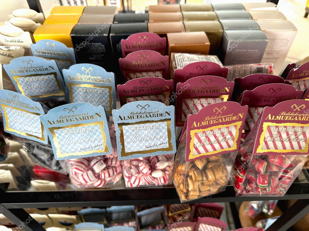 Selection of Almuegaarden candys packaging display. Copenhagen, Denmark - June 5, 2025