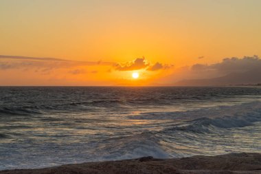 sunrise over the sea in Saquarema, Rio de Janeiro, Brazil. clipart