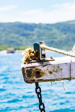 rope and anchor in the ocean in Arraial do Cabo, Rio de Janeiro, Brazil. clipart