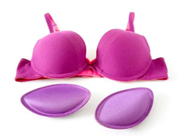 stock image Bra pads and purple brassiere isolated on white background