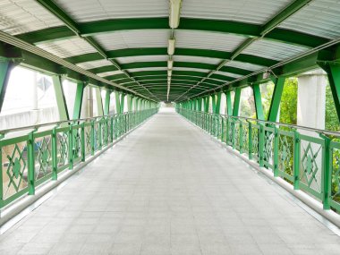 Empty pedestrian overpass which connect to railway station clipart