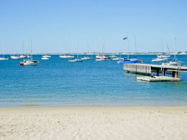 Yachts and jetty on a sunny day
