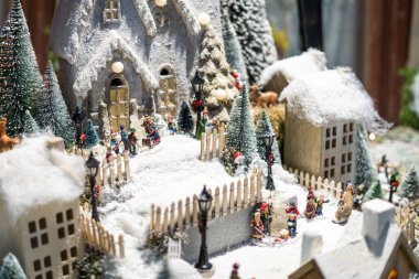 Miniature snowy Christmas village scene