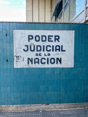 Graffiti on the wall of the Argentine Judicial Power building, with a painted message about national corruption, reflecting political discontent in Buenos Aires. clipart