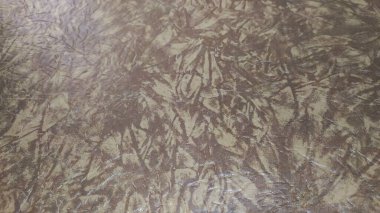 Kahverengi temel doku arka planı. Desen düzensiz ve beyaz kahverengidir.