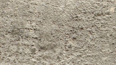 Sertleştirilmiş çimento ile içine kum karıştırılmış arka plan dokusu yüzeyde yükselir..
