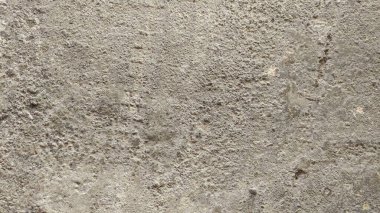 Sertleştirilmiş çimento ile içine kum karıştırılmış arka plan dokusu yüzeyde yükselir..