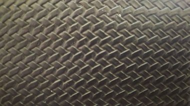 Örülmüş sentetik deri dokusu, siyah cüzdan. Yakın plan..