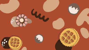 Açık yeşil zemin, gülümseyen zencefilli kurabiyeler ve çiçek şeklindeki şekerlemelerle dolu dağınık bisküvi dokuları ve sarı şeker şekilleriyle çevrili..