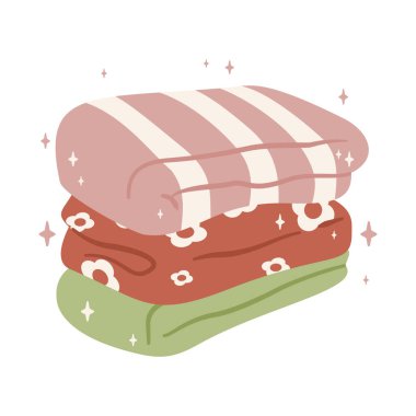 Yumuşak, katlanmış yeşil ve pembe battaniyeler çiçek desenli, rahat, ev ve rahatlama temaları için mükemmel. 