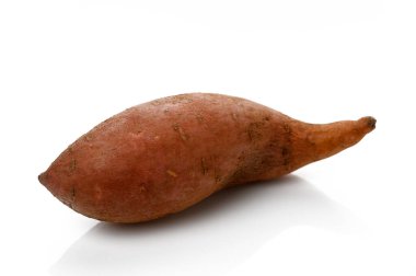 Freshly harvested sweet potato showcasing its unique shape and earthy hue, ready to be utilized in various dishes. clipart