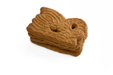 Kaprisli hayvan şekilli üç güzel zencefilli kurabiye harmoni içinde istiflenmiştir..