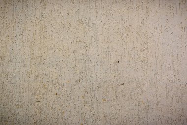 Yakın plan, yumuşak renklerde dokulu bir duvar gösteriyor. Doğanın sanatını takdir etmeye teşvik ediyor..