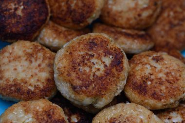 Deliciously fried patties stacked together, showcasing a crispy exterior and fluffy interior, perfect for any meal.