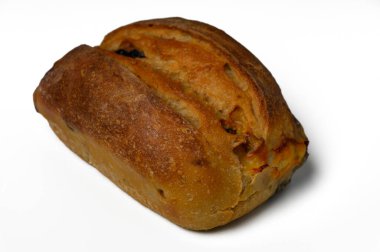 Kırsal bir ekmek somunu, çıtır çıtır altın bir kabuk ve yumuşak hava dokusuyla davetkar bir şekilde oturur. Sandviçler için ya da yemeğin yanında olmak için mükemmel. Kokusu sıcaklığı ve rahatlığı gösterir..