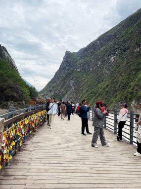 02-07-2024,Yunnan, China, Many tourists visit Tiger Leaping Gorge, Lijiang city. clipart