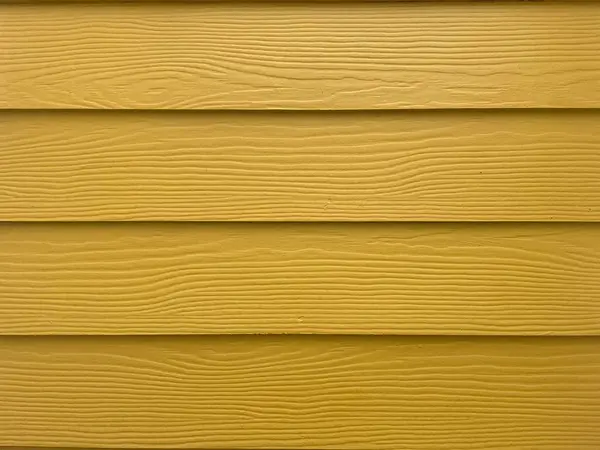 Arkaplan dokusu konsepti için sarı ahşap duvarın güzel yüzeyi.