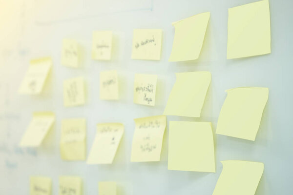 Close up and selective focus blank sticky note on whiteboard in workshop training cost
