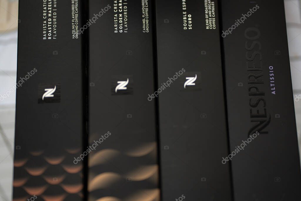 Pathum Thani, Thailand :17 April 2025.Boxes of nespresso on table. Nespresso coffee capsules is a type of pre-apportioned single-use container of ground coffee beans, sometimes with added flavoring.