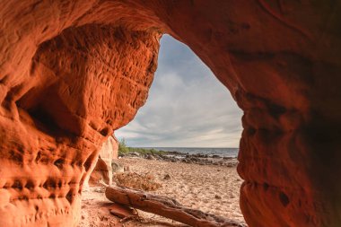 View to the Baltic sea from Ezhurgas cave, Latvia on summer day clipart