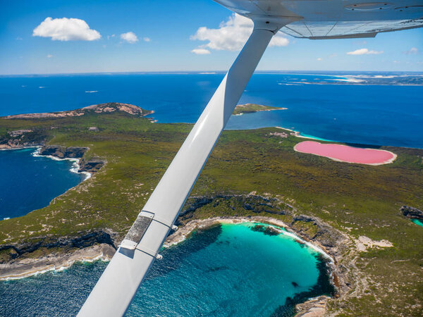 Flying over the pink lake, Lake Hillier near Esperance in Western Australia