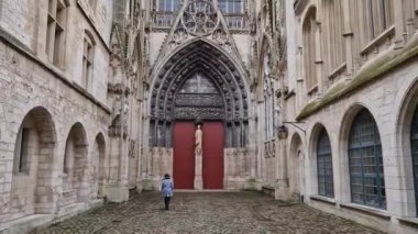 Outdoor facade view of Notre Dame de Rouen Cathedral in the Normandy, France. Architectural landmark featuring styles from Early Gothic to late Flamboyant and Renaissance architecture