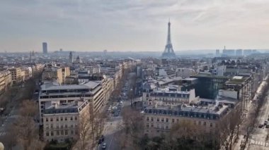Aerial Paris cityscape with view to the Eiffel Tower, France. Beautiful parisian architecture with historic buildings, landmarks and busy city streets