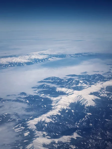 stock image Mountainscape aerial view above the Carpathian mountains snowy peaks, vertical background