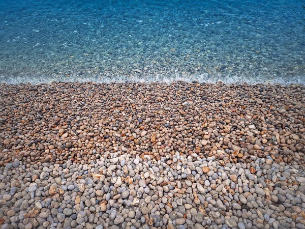 Pebble Rocks Beach Blue Sea Water Texture — Stockfoto