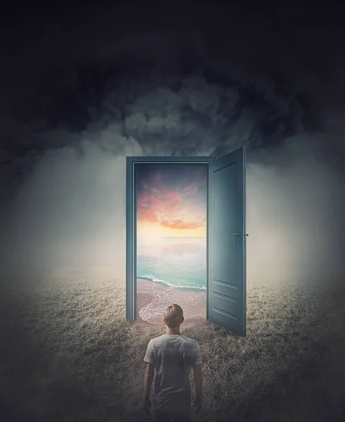 Teleportation door to your hidden dreams. A person in a dark land in front of a doorway as portal leading to a tropical beach with blue sea and sunset view. Magical and surreal scene, travel concept