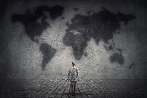 Person Stands Front Concrete Wall Looking World Map Travel Limitations — Stock Photo, Image