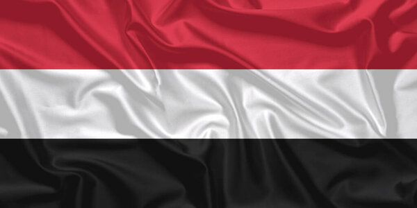 Йеменский флаг ветер машет крупным планом