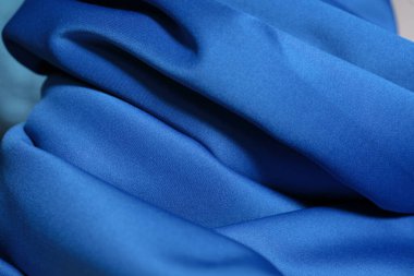 Doku, arka plan, desen. Mavi kumaş dokusu. Gündelik elastik malzeme neopren, değişken kullanım, çalışması kolay.