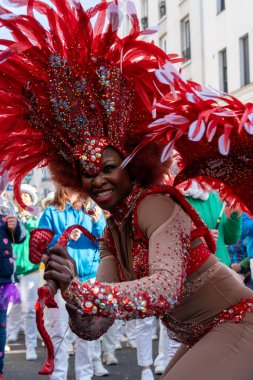 Paris,France-02-03-2025 Vibrant costumes and lively music fill the streets of Paris as performers engage the crowd during the unforgettable Paris Carnival 2025. clipart