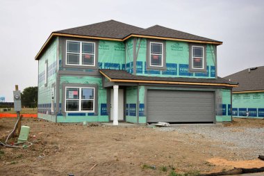 Greenfield, Indiana, USA - September 22 2024: A home building boom leads to new home construction in the suburbs in the midwest. Greenfield, Indiana. clipart