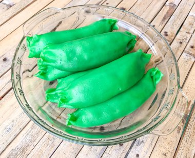 Pisang Ijo traditional dessert of Makassar Indonesia, made from banana wrapped with green flour. Usually served in Ramadan Months iftar. clipart