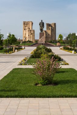 Statue of Amir Temur and heritage twin buildings in Ak-Saray Palace, Shahrisabz, Uzbekistan clipart