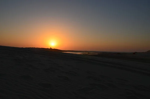 Sunrise in the desert on a cold winter day at Al Adaid, Qatar
