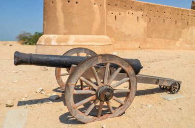 Cannon in front of the historical Al Zubarah fort in Qatar with an cannon clipart