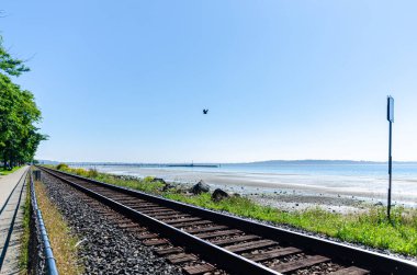 Railway along the coastline at White Rock, Surrey, British Columbia, Canada clipart