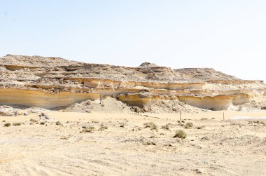 Bu Salwa Shelf Hills Desert landscape with limestone hillocks in the background, Qatar clipart