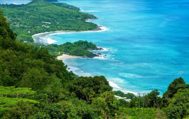 West coast of the Island Mahe, Republic of Seychelles, Africa. Bay Grand Anse in the foreground, Bay Anse Barbarons in the background.